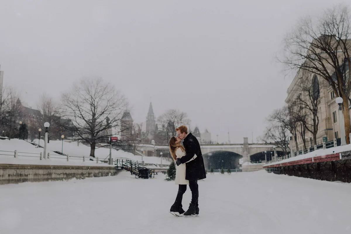 Kaitlyn and Alex during their engagement shoot on the frozen canal