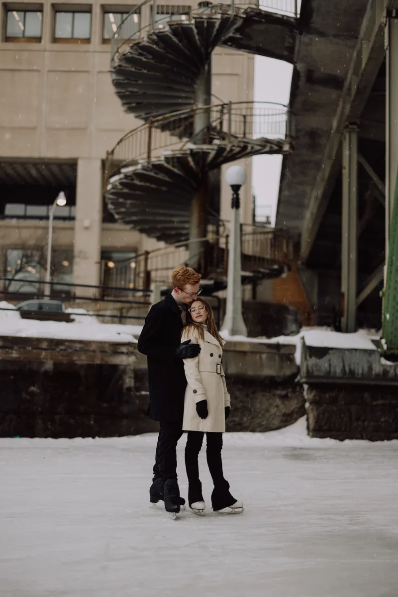 Kaitlyn and Alex during their engagement shoot on the frozen canal