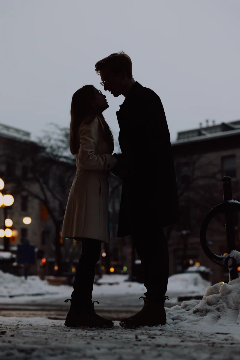 Kaitlyn and Alex during their engagement shoot on the frozen canal