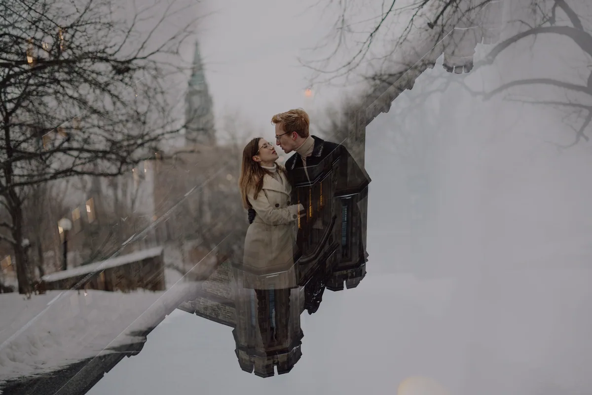 Kaitlyn and Alex during their engagement shoot on the frozen canal