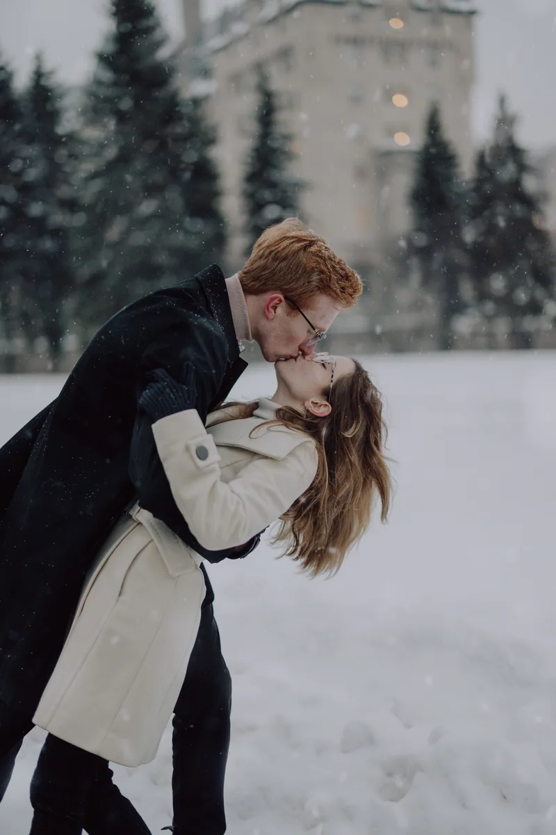 Kaitlyn and Alex during their engagement shoot on the frozen canal
