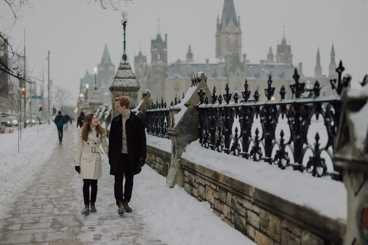 Kaitlyn and Alex during their engagement shoot on the frozen canal