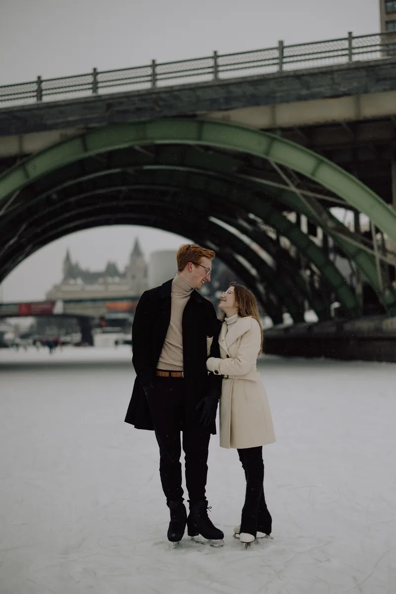 Kaitlyn and Alex during their engagement shoot on the frozen canal