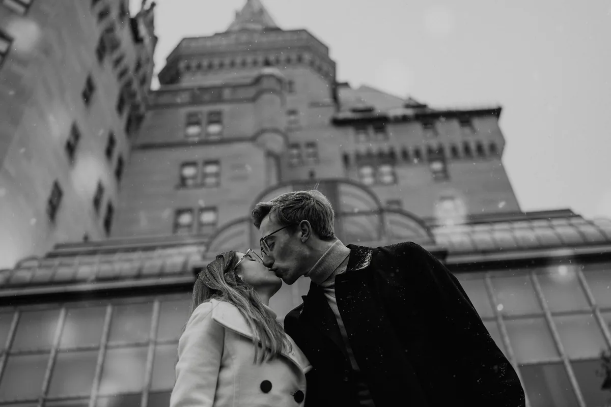 Kaitlyn and Alex during their engagement shoot on the frozen canal