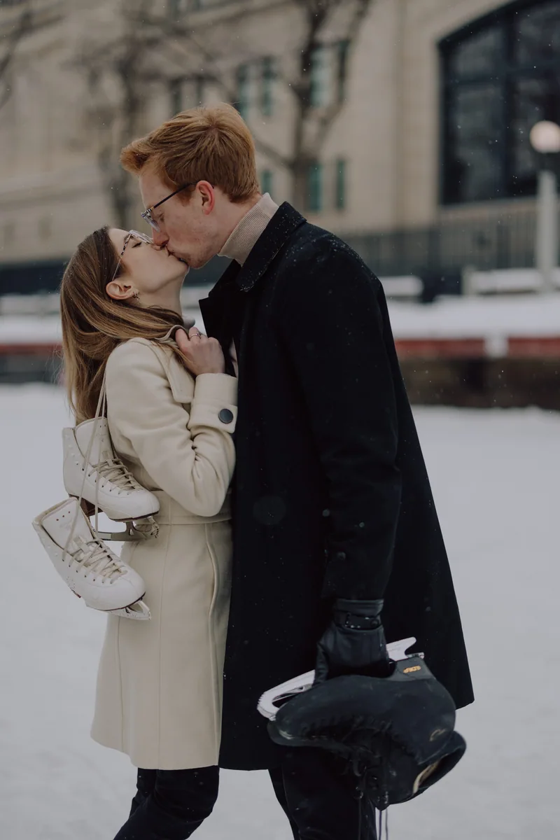 Kaitlyn and Alex during their engagement shoot on the frozen canal