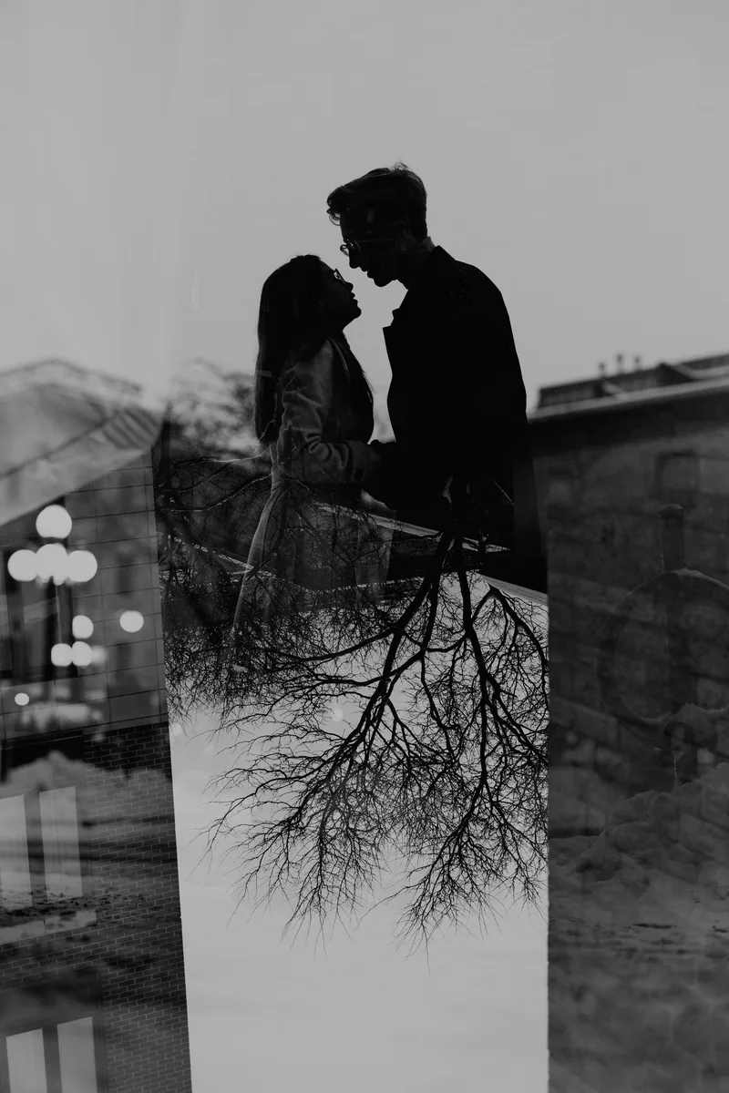 Kaitlyn and Alex during their engagement shoot on the frozen canal