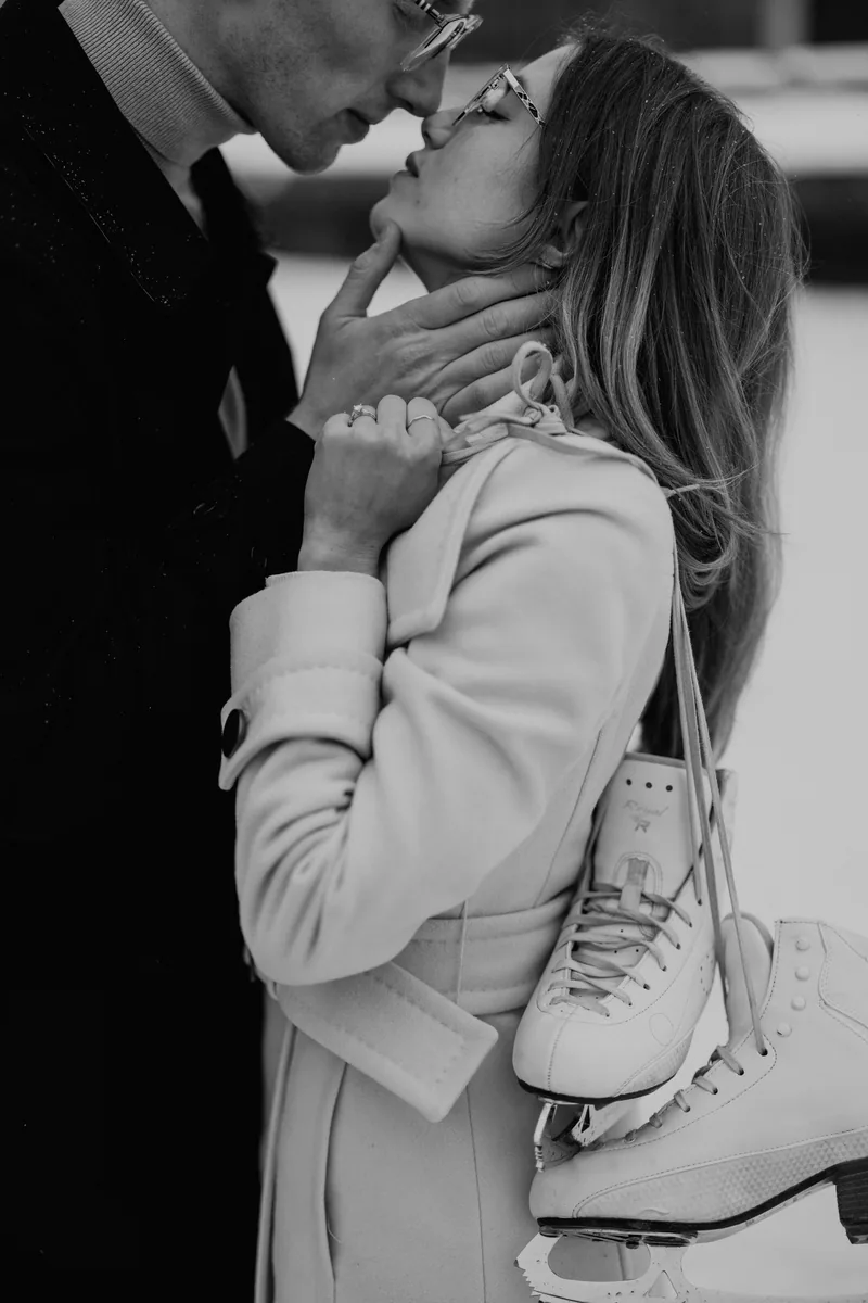 Kaitlyn and Alex during their engagement shoot on the frozen canal