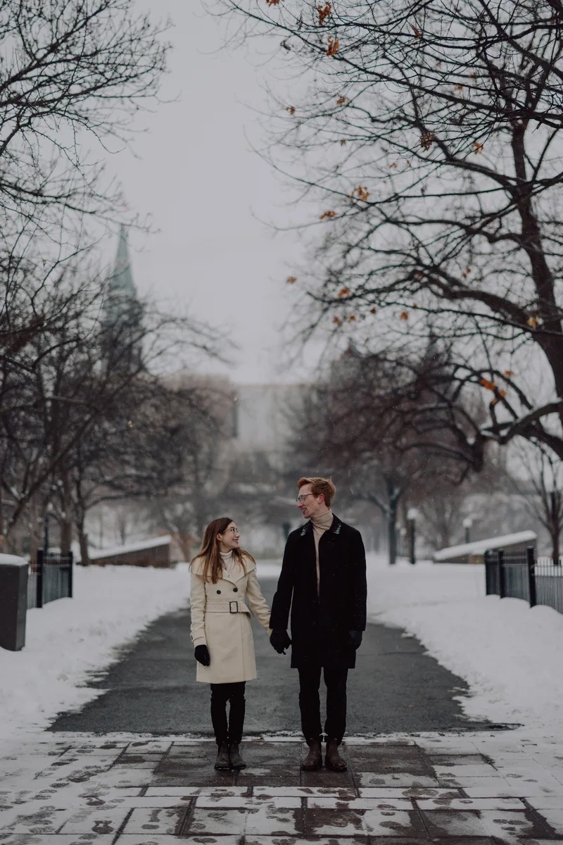 Kaitlyn and Alex during their engagement shoot on the frozen canal