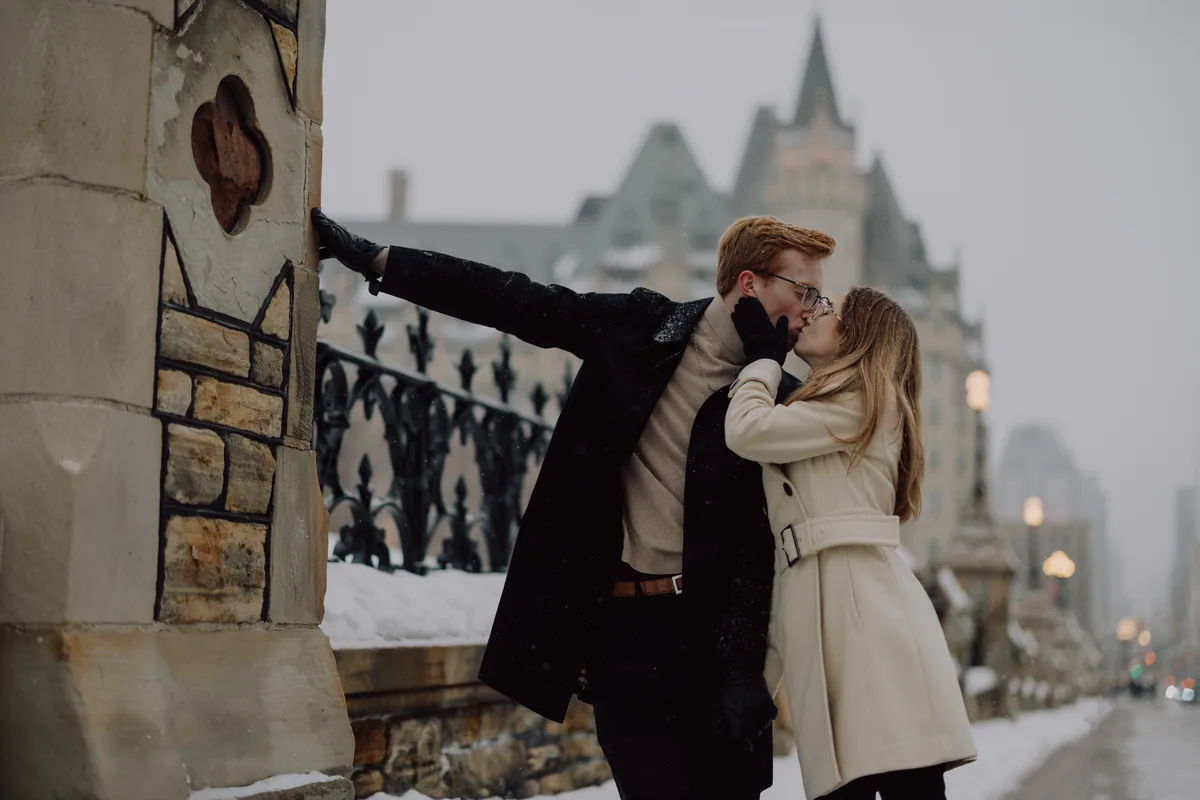 Kaitlyn and Alex during their engagement shoot on the frozen canal