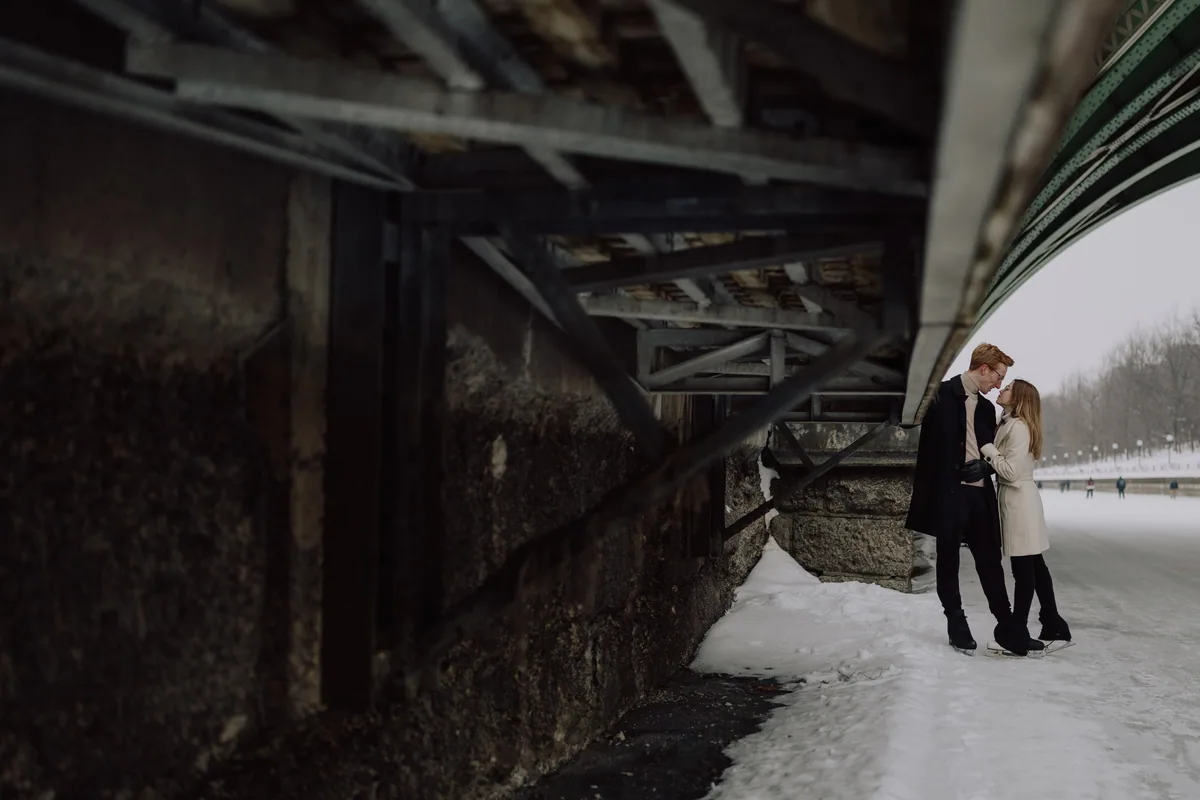 Kaitlyn and Alex during their engagement shoot on the frozen canal