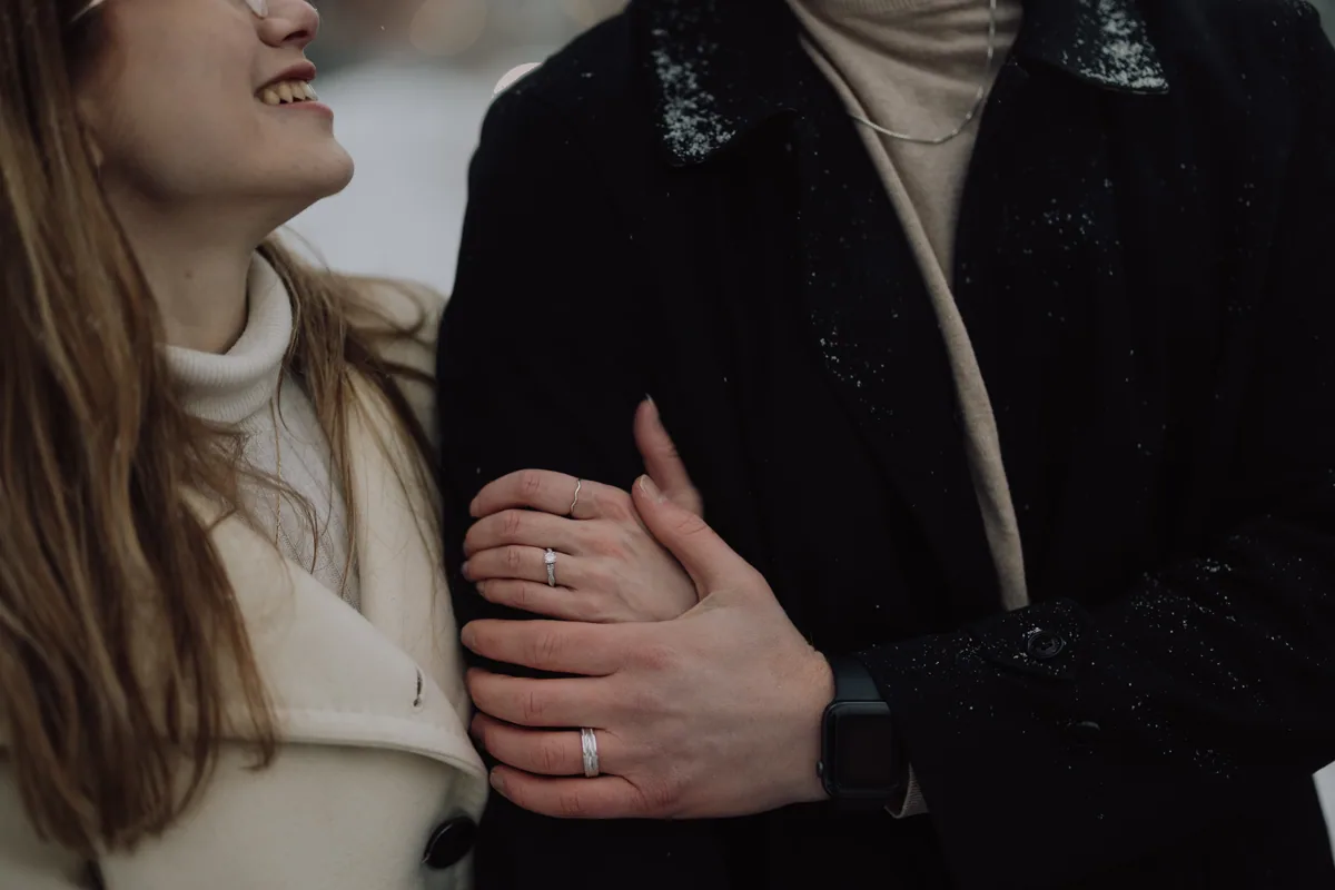 Kaitlyn and Alex during their engagement shoot on the frozen canal