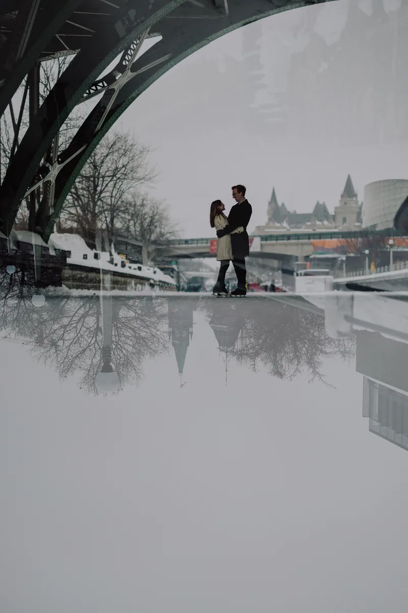 Kaitlyn and Alex during their engagement shoot on the frozen canal
